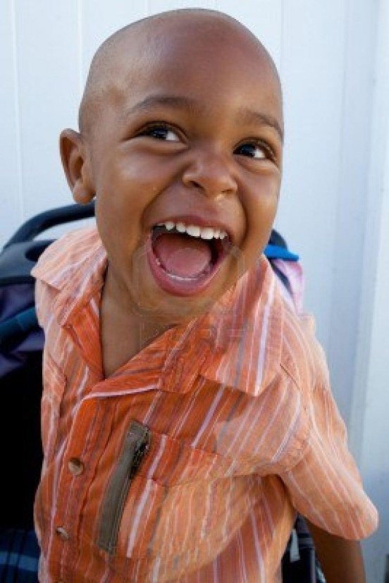 handsome-little-african-american-boy-smiling-for-the-camera-1825463941